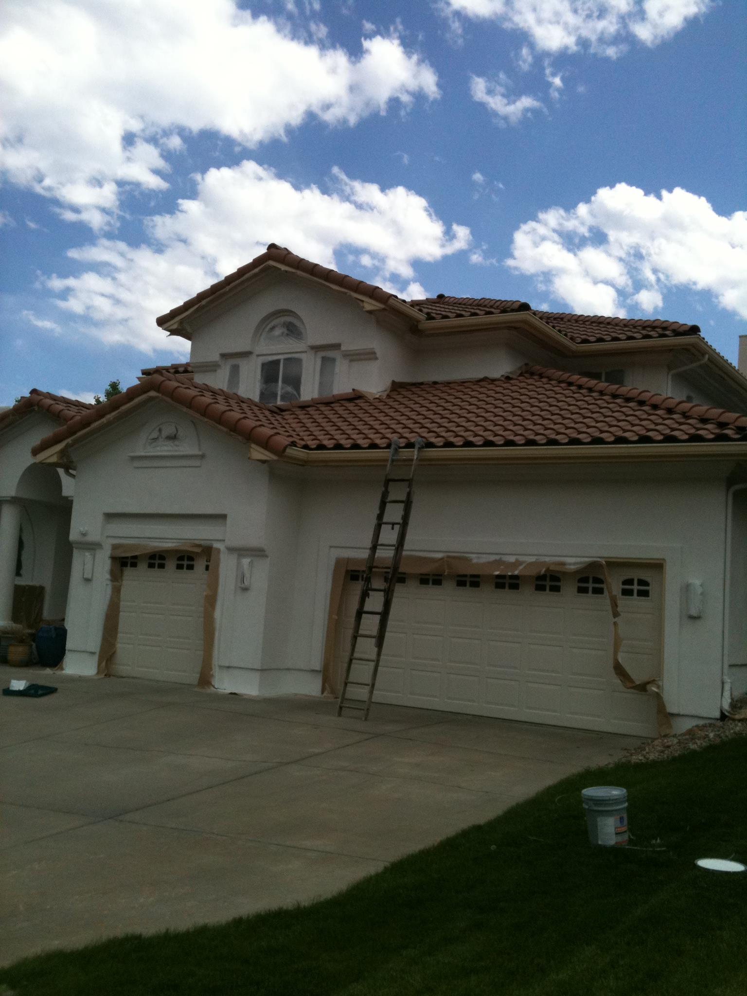 Three-bay Mediterranean stucco home with tile roof