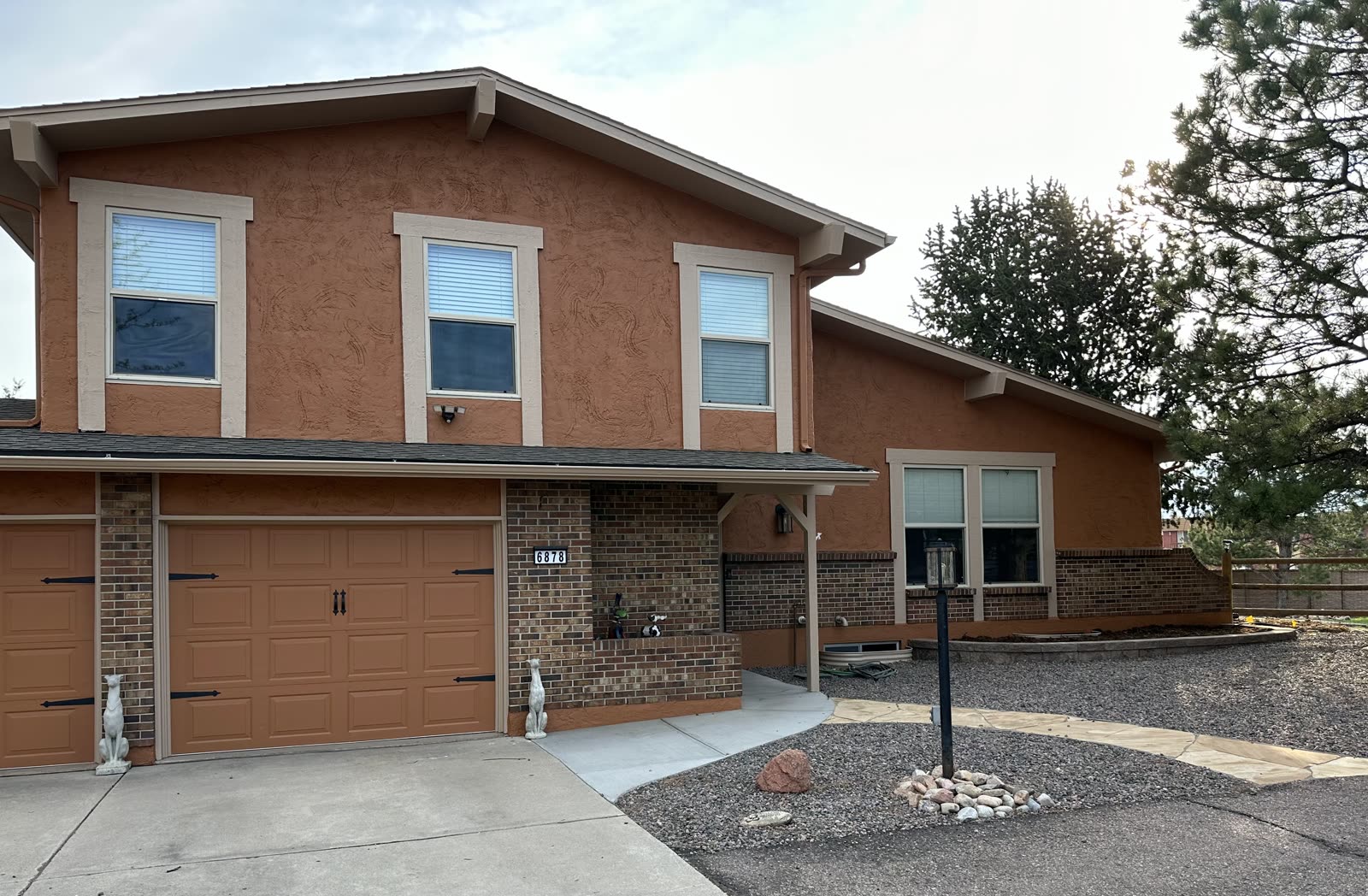 Freshly painted stucco home in Colorado Springs by Confident Coatings