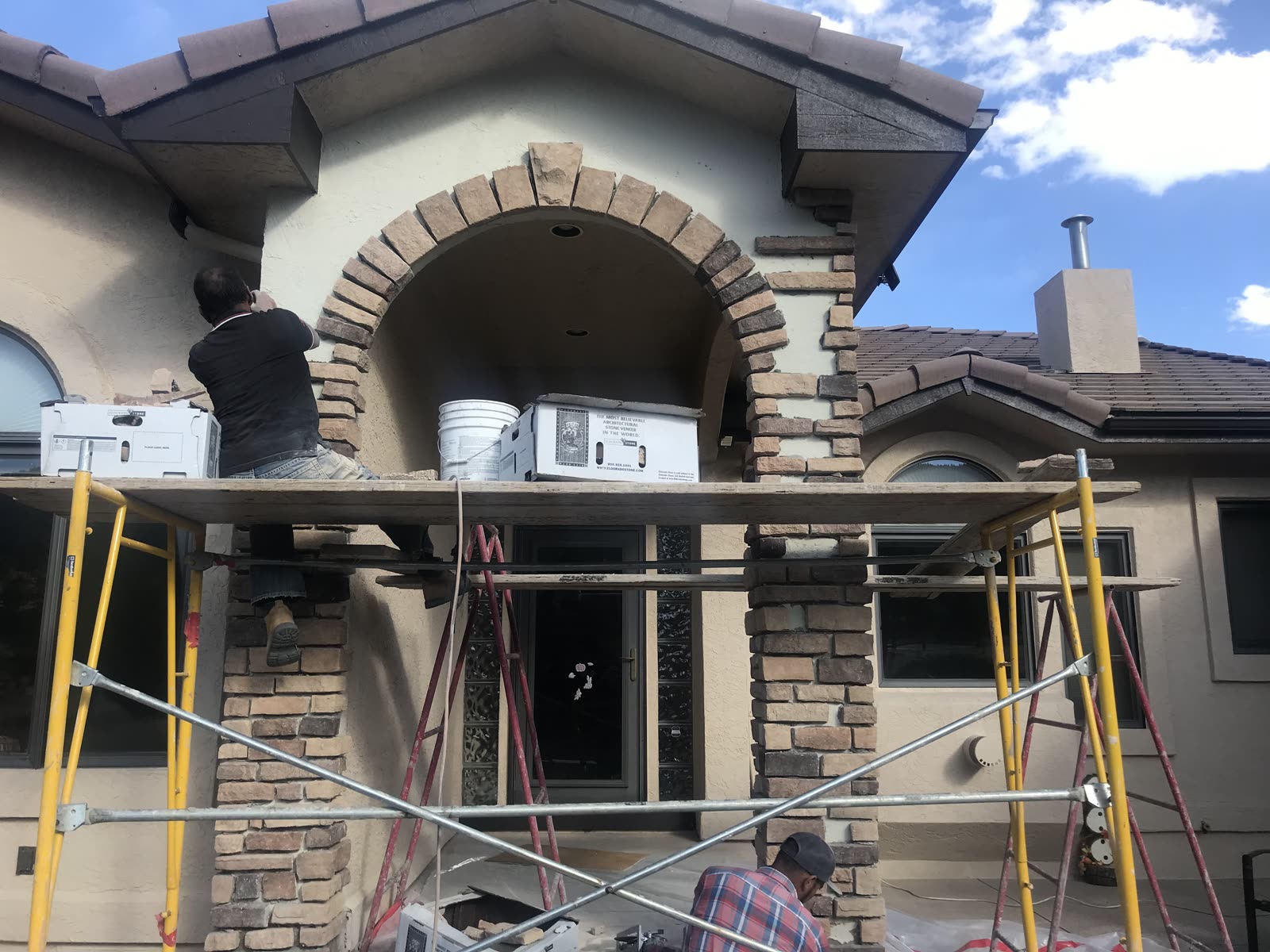 Stucco repair work matching original texture and color